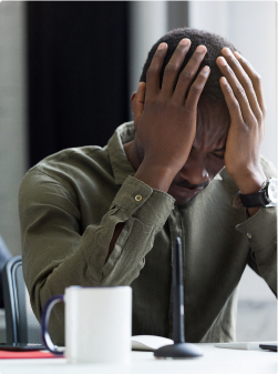 A person making a mistake on a tablet, representing professional mistakes not covered by GLI.